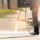 What do you spray on concrete before pressure washing?