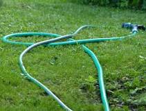 How do you fix a clogged garden sprayer?
