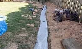 How deep should a drainage trench be?